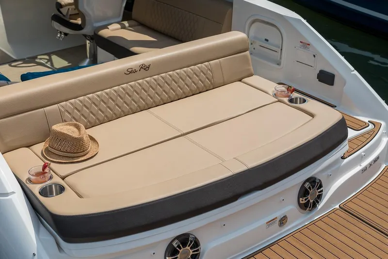 Slide: The Image of Manufacturer Provided Image: 2019 Sea Ray SLX 250 boat with beige seating and cup holders. - 11