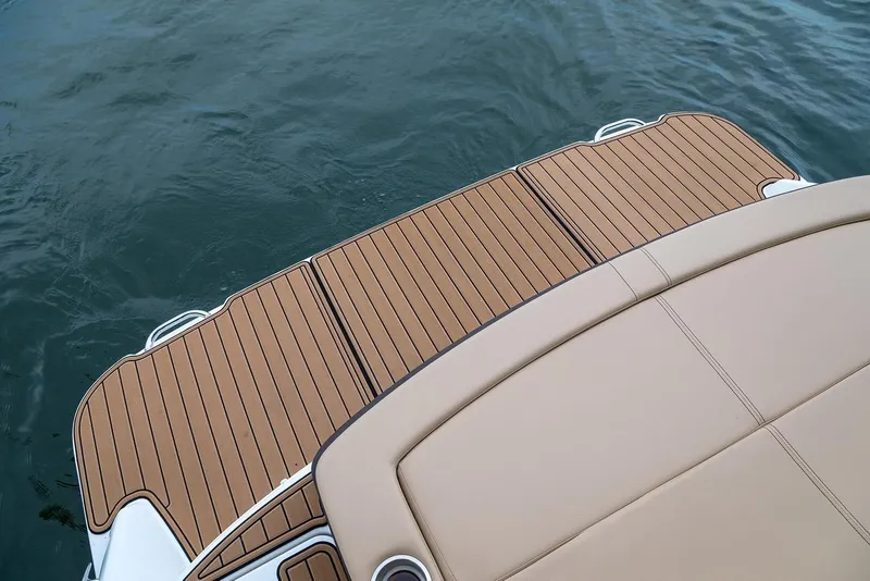 Slide: The Image of Manufacturer Provided Image: 2019 Sea Ray SLX 250 swim platform and seating area on water. - 12