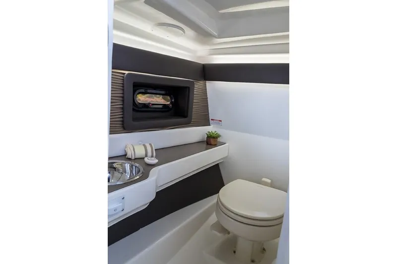 Slide: The Image of Manufacturer Provided Image: 2019 Sea Ray SLX 250 boat interior bathroom with sink and toilet. - 15