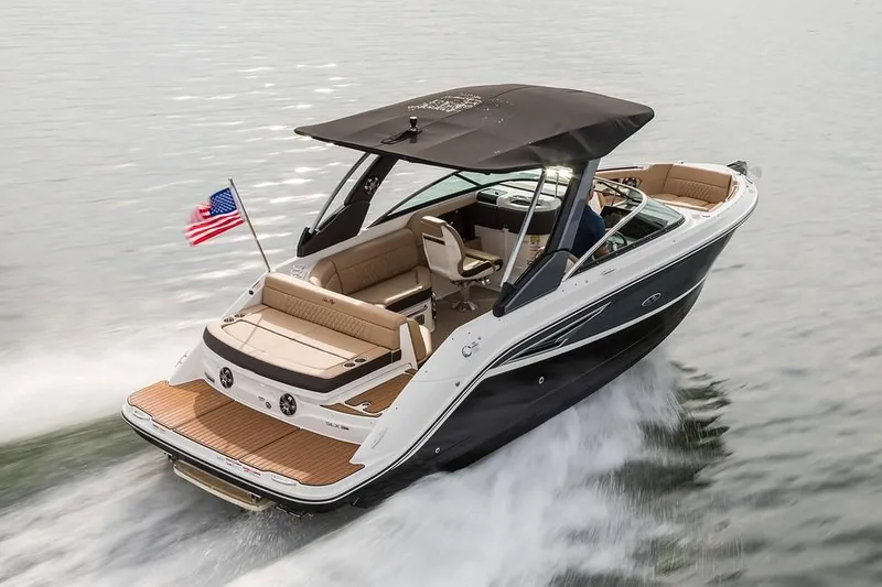 Slide: The Image of Manufacturer Provided Image: 2019 Sea Ray SLX 250 boat cruising on water with American flag. - 3
