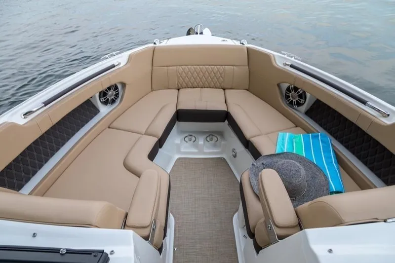 Slide: The Image of Manufacturer Provided Image: 2019 Sea Ray SLX 250 boat interior with tan seating and blue towel. - 5