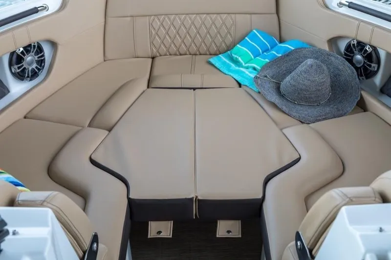Slide: The Image of Manufacturer Provided Image: 2019 Sea Ray SLX 250 boat interior with tan leather seating and accessories. - 6