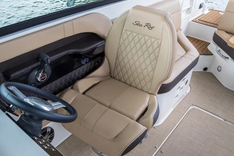 Slide: The Image of Manufacturer Provided Image: 2019 Sea Ray SLX 250 captain's chair with beige upholstery and diamond stitching. - 8