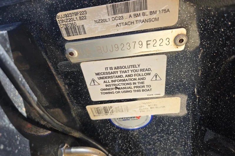 Slide: The Image of Close-up of Nitro Z20 Pro 2023 boat identification and safety instruction labels. - 10