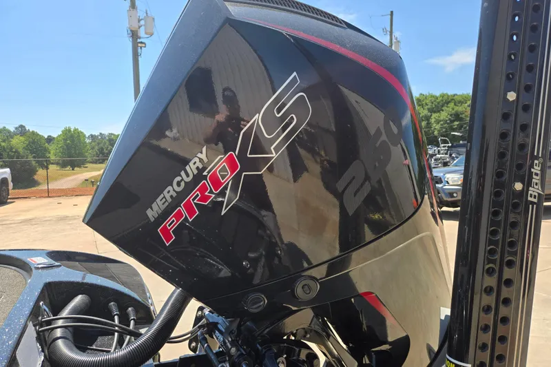 Slide: The Image of Mercury Pro XS engine on 2023 Nitro Z20 Pro boat, outdoor setting. - 11