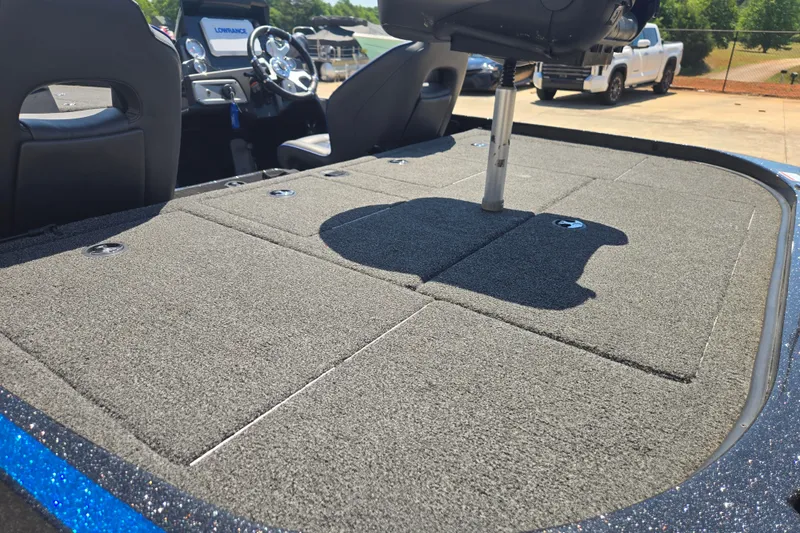 Slide: The Image of 2023 Nitro Z20 Pro boat interior with carpeted deck and steering console. - 12