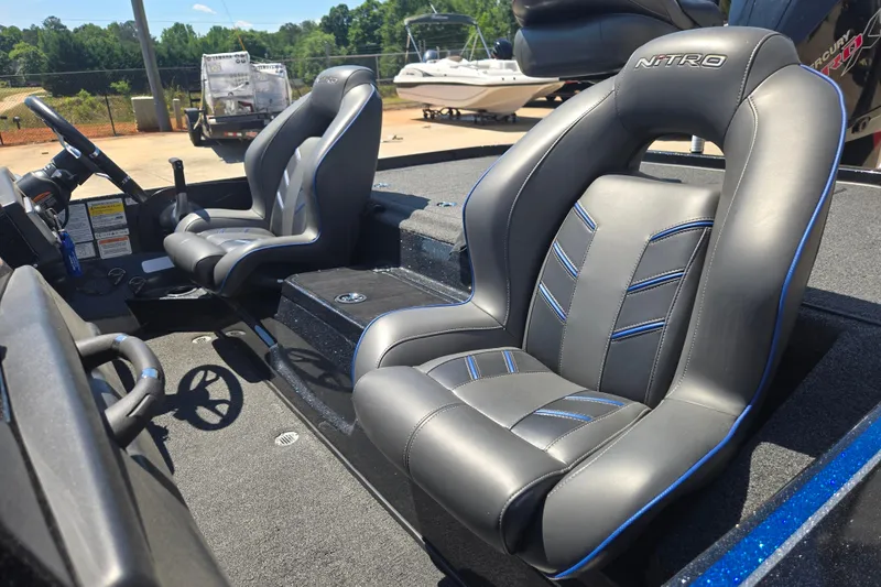 Slide: The Image of 2023 Nitro Z20 Pro boat interior with sleek, modern seating and steering wheel. - 15