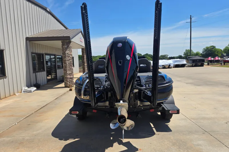 Slide: The Image of 2023 Nitro Z20 Pro boat parked outside a building on a sunny day. - 22
