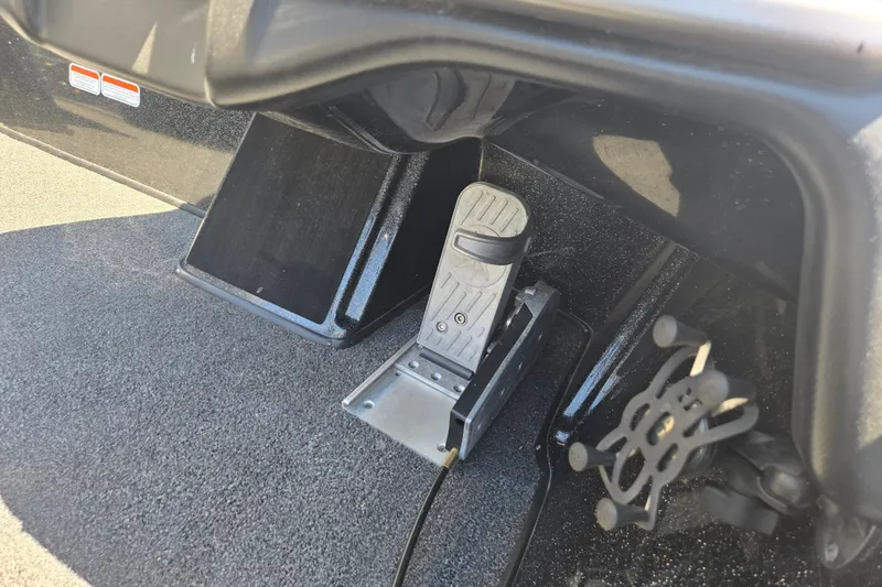 Slide: The Image of Foot pedal control in a 2023 Nitro Z20 Pro boat cockpit. - 6