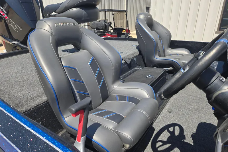 Slide: The Image of 2023 Nitro Z20 Pro boat interior with sleek, modern seating and steering wheel. - 7