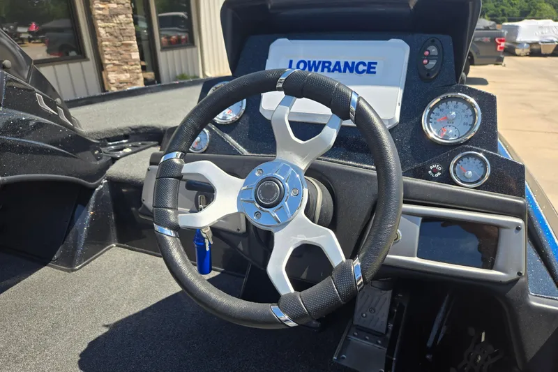 Slide: The Image of Steering wheel and dashboard of 2023 Nitro Z20 Pro boat with Lowrance display. - 8