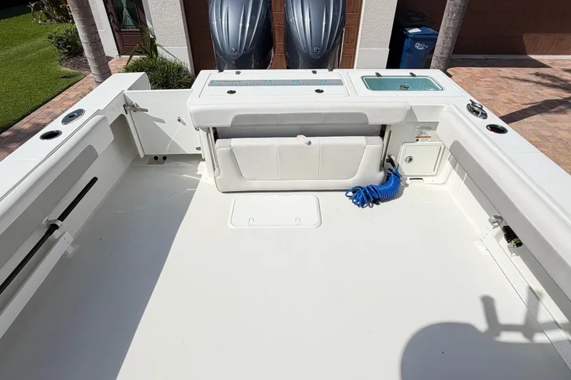 Slide: The Image of 2022 Parker 2801 Center Console boat deck with storage and seating features. - 14