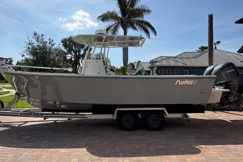 Slide: The Image of 2022 Parker 2801 Center Console boat on trailer, parked outdoors under clear sky. - 5