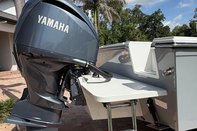 Slide: The Image of Yamaha outboard motor on 2022 Parker 2801 Center Console boat, parked outdoors. - 6