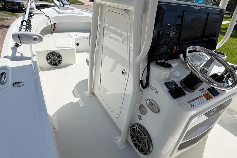 Slide: The Image of 2022 Parker 2801 Center Console boat interior with steering wheel and control panel. - 8