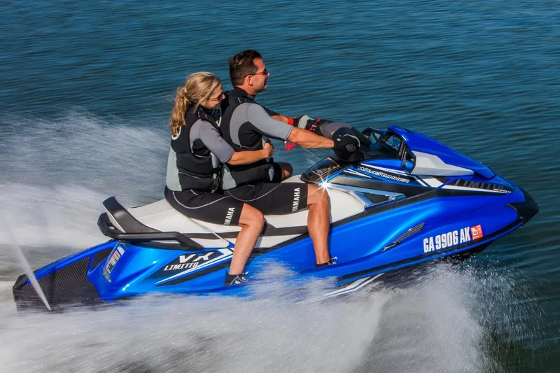 Slide: The Image of Manufacturer Provided Image: 2017 Yamaha WaveRunner VX Limited jet ski with two riders speeding on water. - 16