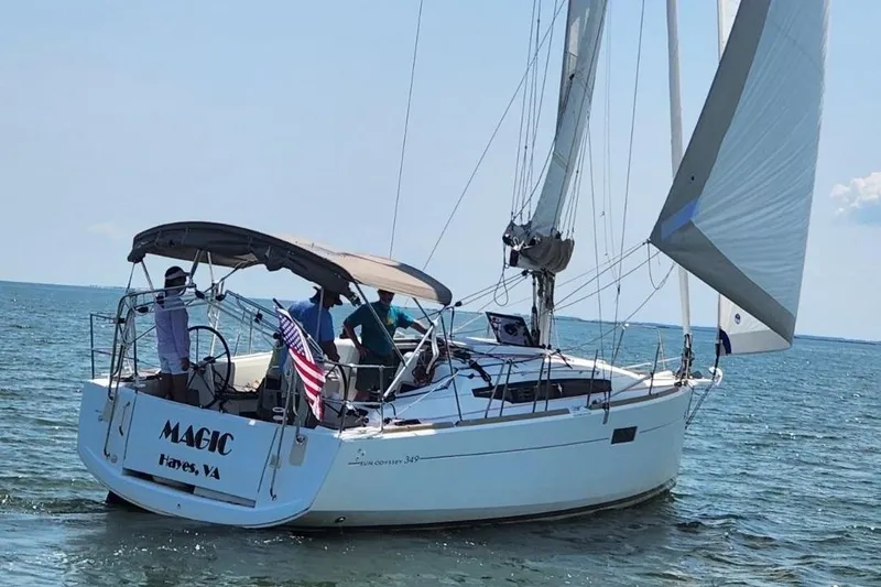 The Image of 2015 Jeanneau Sun Odyssey 349 sailboat named "Magic" sailing in calm waters. - 1