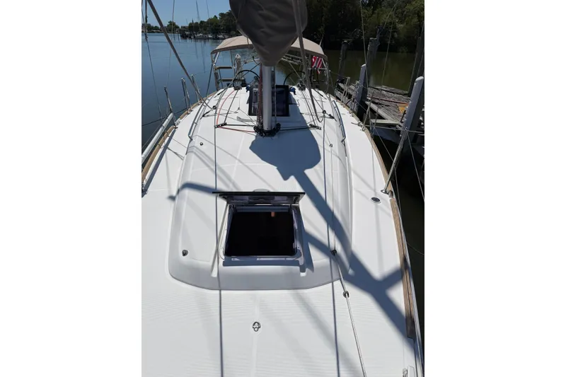 Slide: The Image of 2015 Jeanneau Sun Odyssey 349 sailboat deck view at marina. - 12