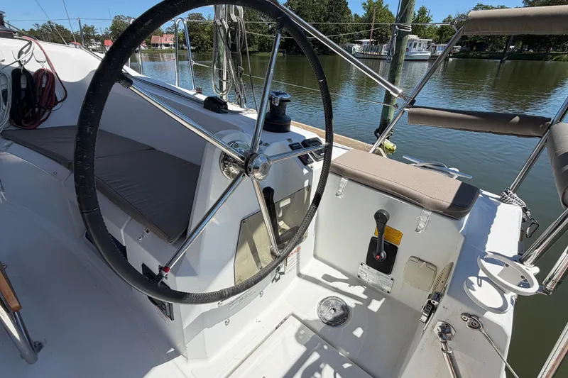 Slide: The Image of Cockpit of 2015 Jeanneau Sun Odyssey 349 sailboat with steering wheel and controls. - 17