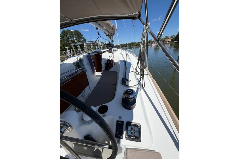 Slide: The Image of Cockpit view of 2015 Jeanneau Sun Odyssey 349 sailboat on calm water. - 18
