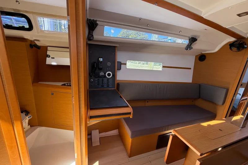 Slide: The Image of Interior of 2015 Jeanneau Sun Odyssey 349 sailboat with seating and navigation panel. - 27