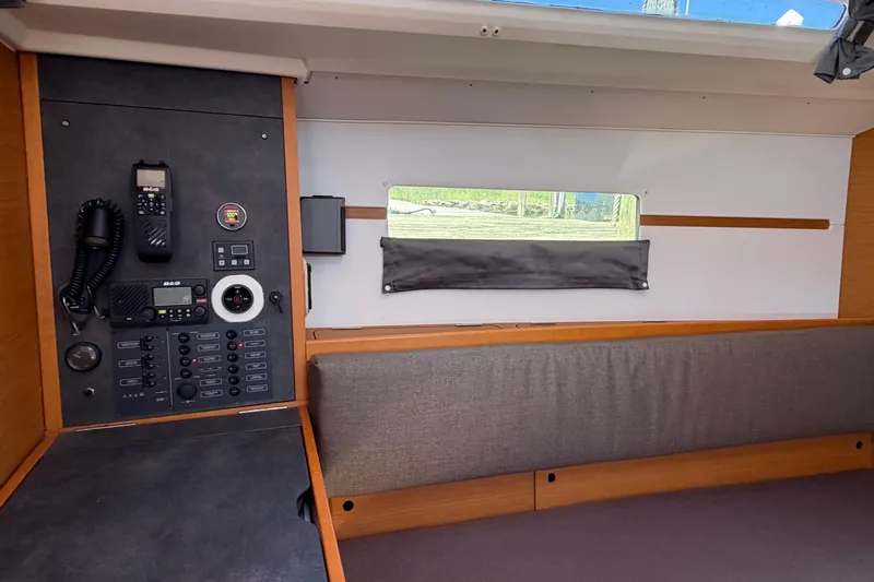Slide: The Image of Interior view of 2015 Jeanneau Sun Odyssey 349 sailboat with navigation equipment. - 28