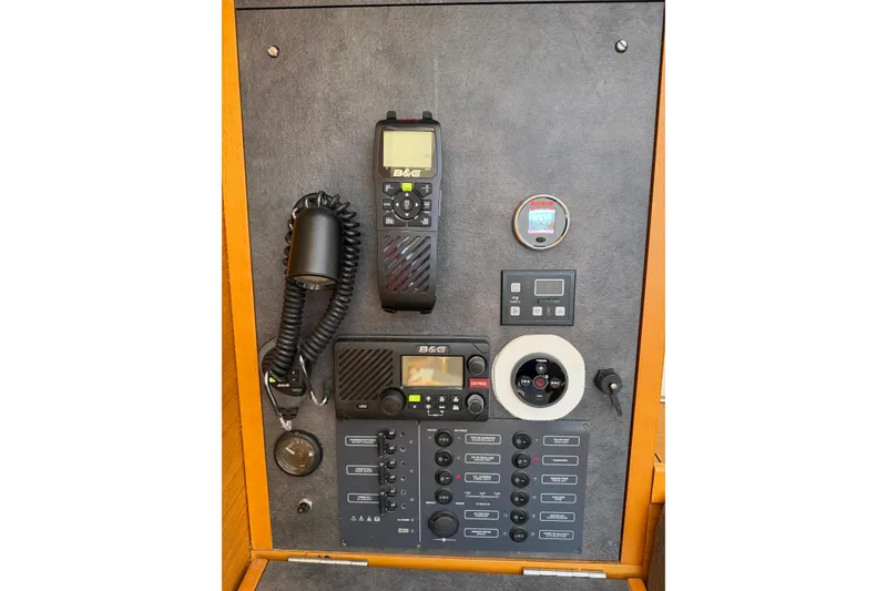 Slide: The Image of Control panel of 2015 Jeanneau Sun Odyssey 349 sailboat with navigation and communication equipment. - 29
