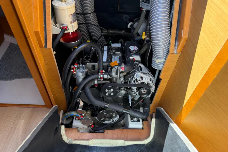 Slide: The Image of Engine compartment of a 2015 Jeanneau Sun Odyssey 349 sailboat, showcasing detailed components. - 38
