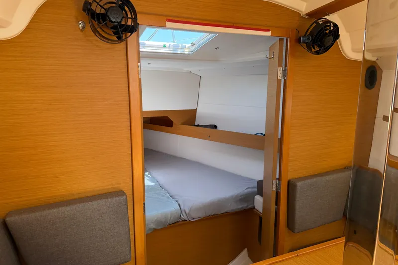 Slide: The Image of Interior cabin of 2015 Jeanneau Sun Odyssey 349 sailboat, featuring cozy sleeping quarters. - 41