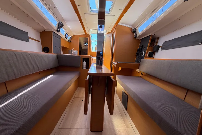 Slide: The Image of Interior of 2015 Jeanneau Sun Odyssey 349 sailboat, featuring cozy seating and modern design. - 43