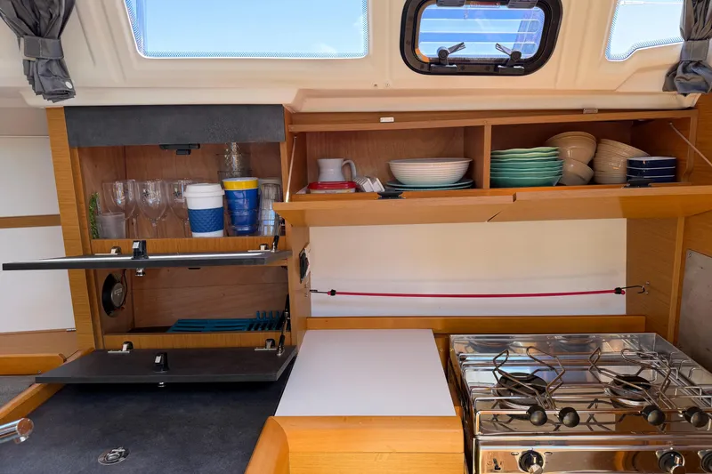 Slide: The Image of Interior of 2015 Jeanneau Sun Odyssey 349 yacht kitchen with stove and storage. - 49