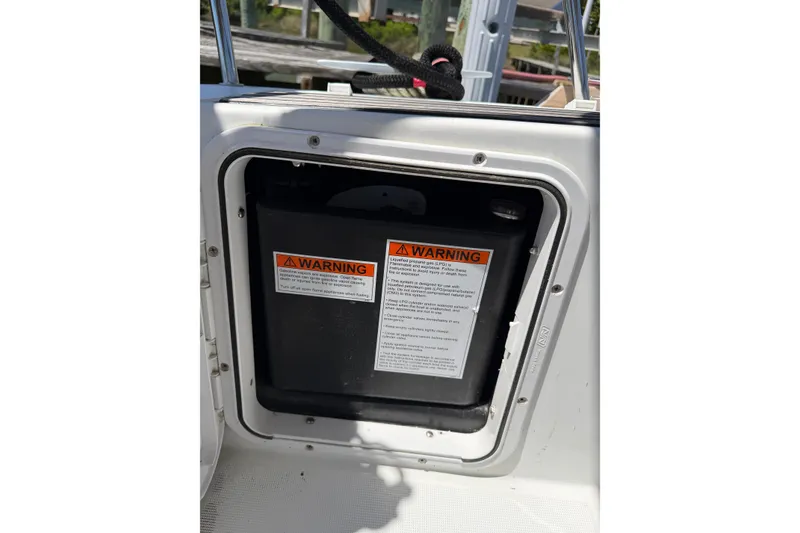 Slide: The Image of 2015 Jeanneau Sun Odyssey 349 warning label on a compartment door. - 50