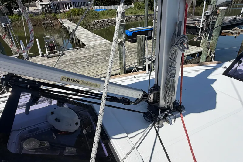 Slide: The Image of 2015 Jeanneau Sun Odyssey 349 sailboat deck with rigging and dock view. - 8