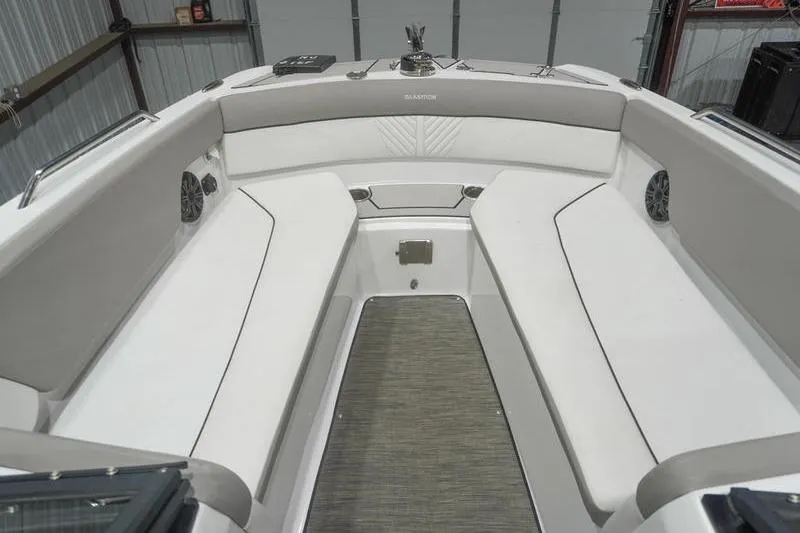 Slide: The Image of 2022 Glastron GTD 220 boat interior with white seating and modern design. - 11