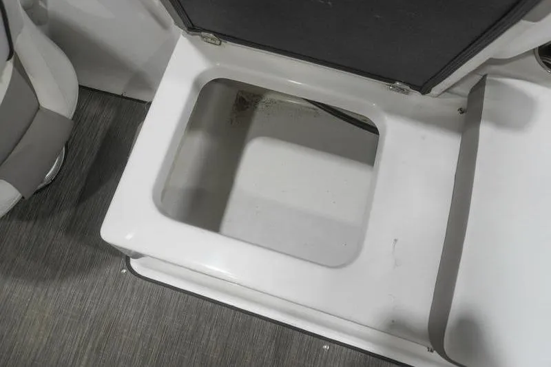 Slide: The Image of Open storage compartment in 2022 Glastron GTD 220 boat interior. - 15