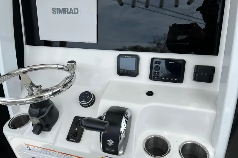 Slide: The Image of Control panel of 2026 Sea Pro 245FLX Sandbar boat with Simrad electronics. - 11