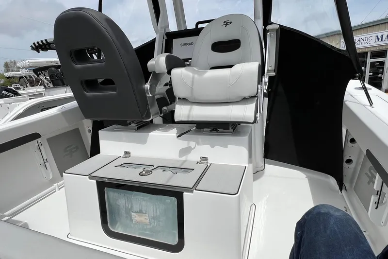 Slide: The Image of Interior view of 2026 Sea Pro 245FLX Sandbar boat with seating and storage. - 12