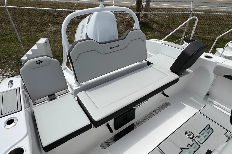 Slide: The Image of 2026 Sea Pro 245FLX Sandbar boat interior with sleek seating and modern design. - 13