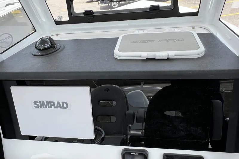 Slide: The Image of Interior of 2026 Sea Pro 245FLX Sandbar boat with Simrad navigation system. - 21
