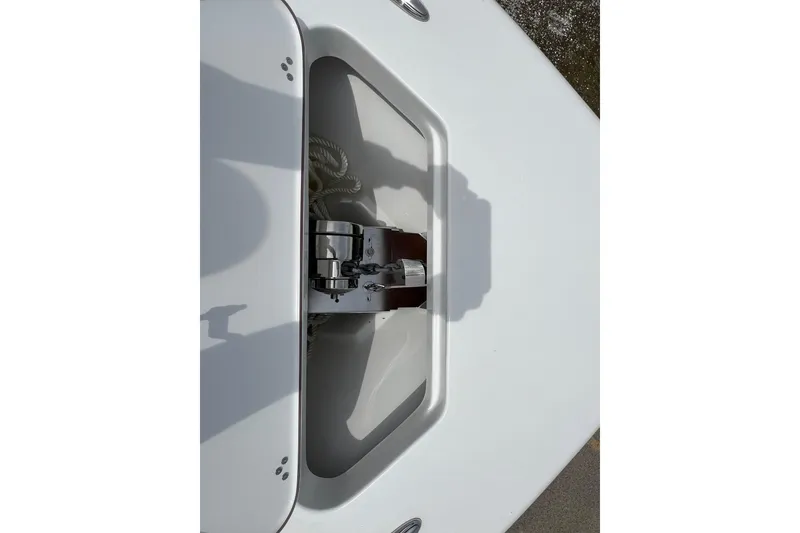 Slide: The Image of Anchor compartment of 2026 Sea Pro 245FLX Sandbar boat, featuring a neatly coiled rope. - 25