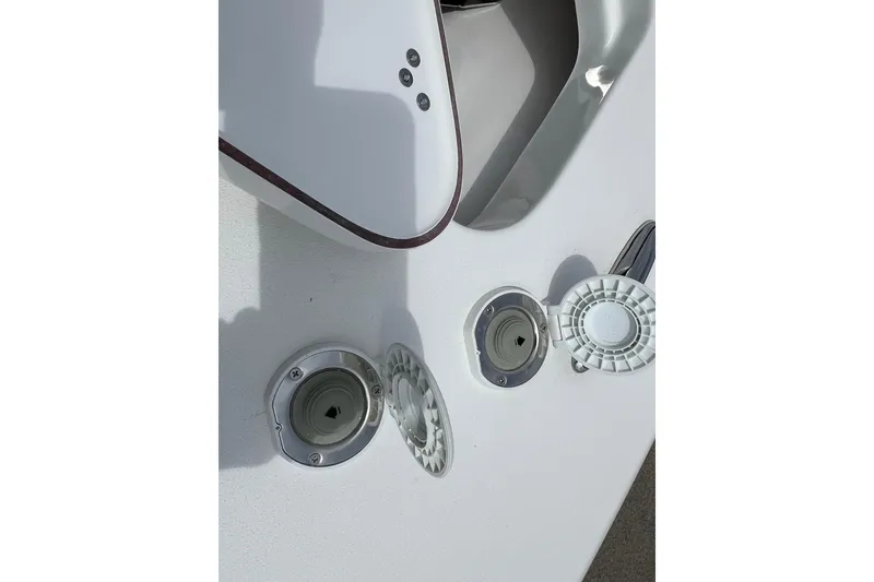 Slide: The Image of Deck fittings on a 2026 Sea Pro 245FLX Sandbar boat, showcasing open hatches. - 26