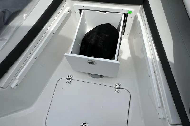 Slide: The Image of Storage compartment on 2026 Sea Pro 245FLX Sandbar boat, featuring sleek white interior design. - 27