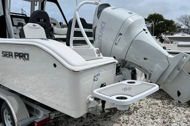 Slide: The Image of 2026 Sea Pro 245FLX Sandbar boat with Suzuki outboard motor, featuring a swim platform. - 3