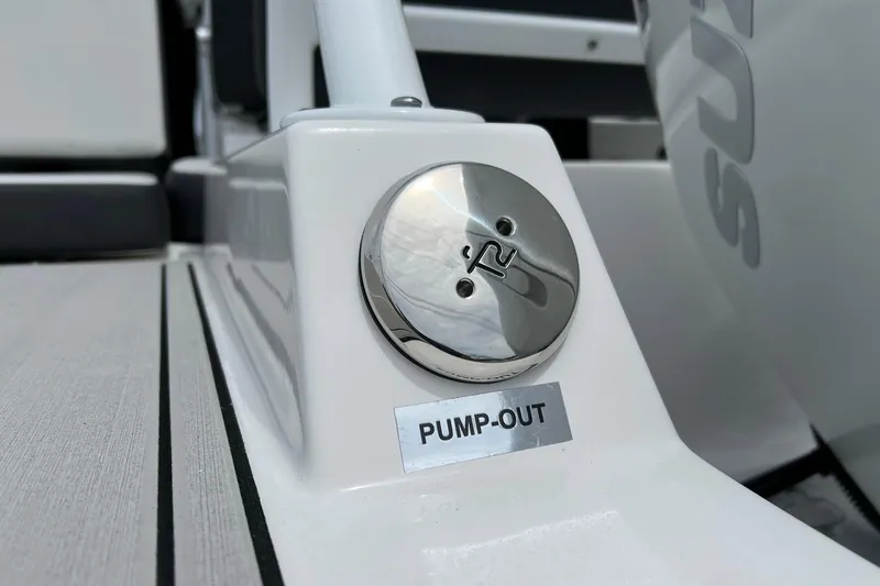 Slide: The Image of 2026 Sea Pro 245FLX Sandbar boat pump-out valve detail on deck. - 32