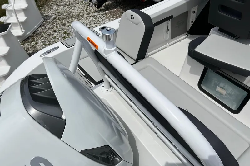 Slide: The Image of 2026 Sea Pro 245FLX Sandbar boat interior with seating and cup holder. - 7