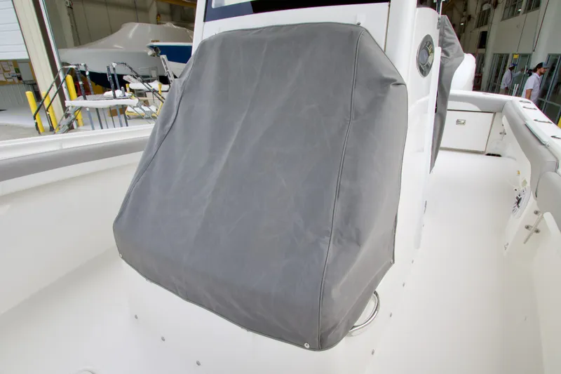 Slide: The Image of Covered console on a 2027 Regulator 25 boat, docked indoors. - 11