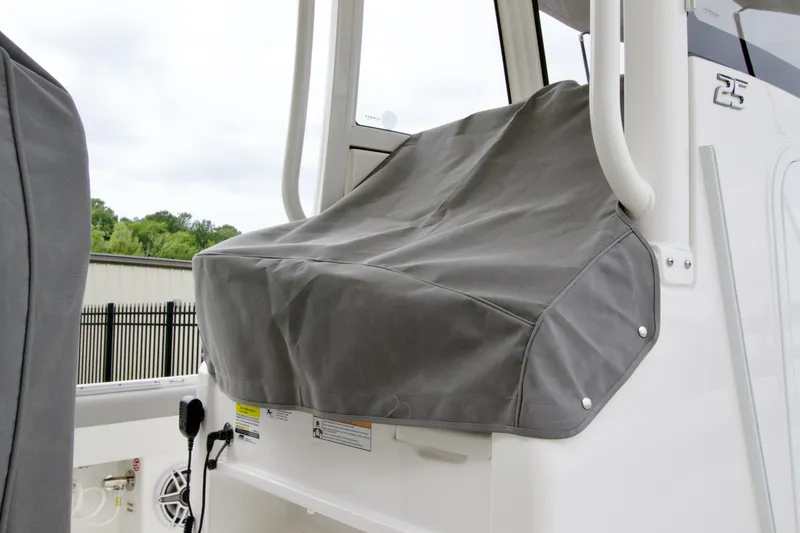 Slide: The Image of 2027 Regulator 25 boat with covered seating area, showcasing sleek design and durable materials. - 5
