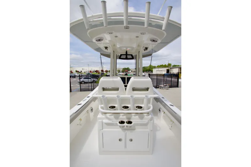 Slide: The Image of 2027 Regulator 25 boat interior with rod holders and storage compartments. - 37