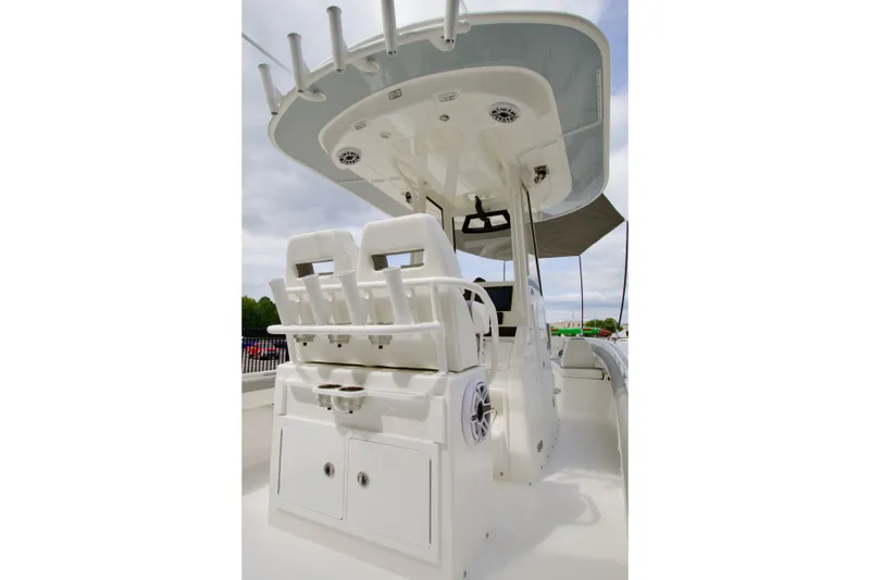Slide: The Image of 2027 Regulator 25 boat interior with helm station and seating under T-top. - 38