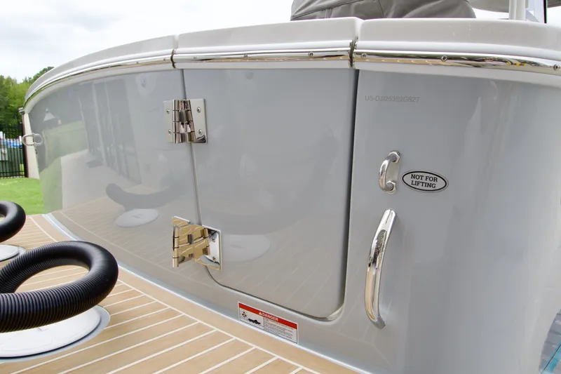 Slide: The Image of 2027 Regulator 25 boat detail, featuring stainless steel hardware and "Not for Lifting" label. - 9